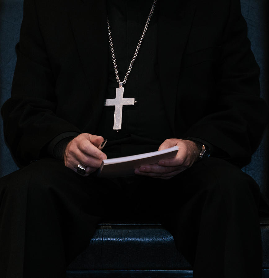 Priest Wearing A Cross Hanging On His Chest And Holding A Book Photograph by Cícero Castro