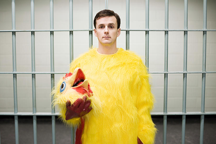 Prisoner in chicken suit Photograph by Image Source
