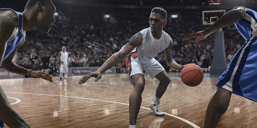 Professional Basketball Player Dribbling Ball Near Opponents During Game Photograph by Peepo