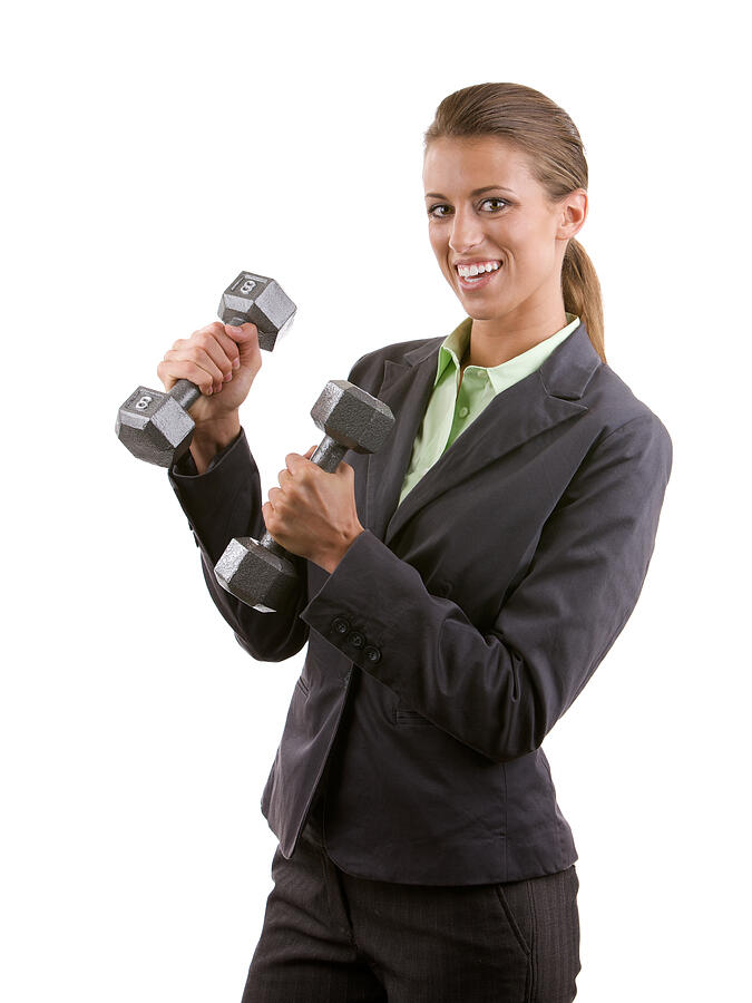Professional woman holding two dumbbells Photograph by Billnoll