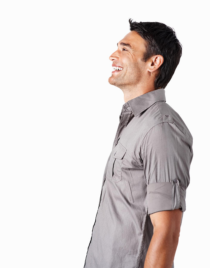 Profile of a smiling mid adult man against white Photograph by Kupicoo