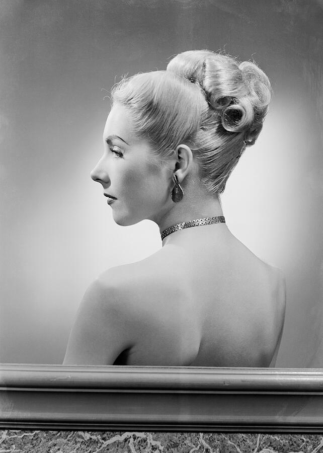 Profile of elegant mid adult woman, studio shot Photograph by George Marks