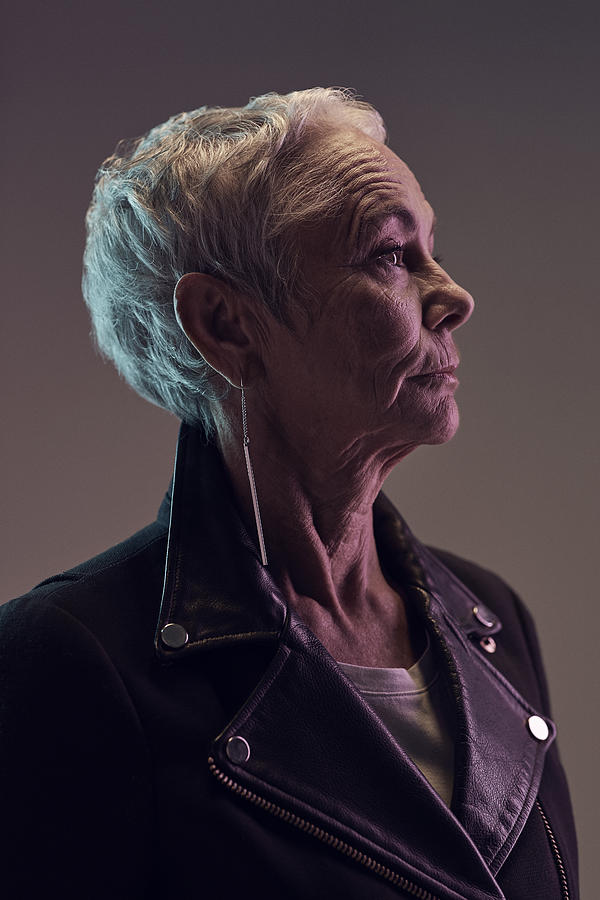 Profile portrait of cool mature woman, with coloured lights Photograph by Klaus Vedfelt