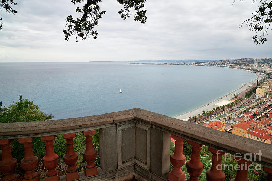 Promenade des Anglais balcony  a white boat in the middle of the bay Photograph by Jose Rey