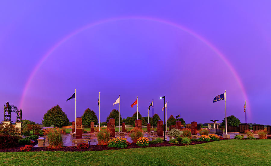 Promise to the Veterans - Full rainbow above the Stoughton Veterans Memorial Park right at sunset Photograph by Peter Herman