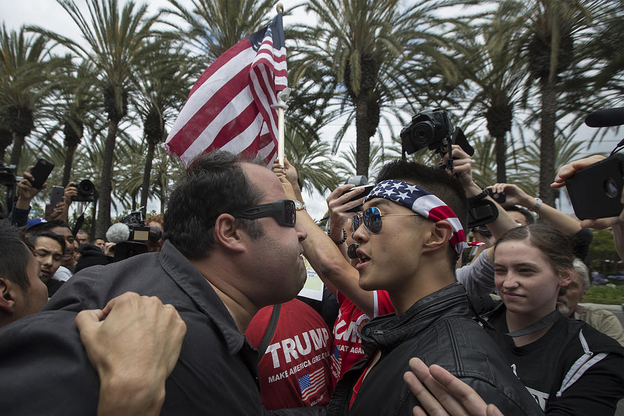 Protestors Rally Outside Trump Campaign Event In Anaheim Photograph by David McNew Protestors Rally Outside Trump Campaign Event In Anaheim Photograph by David McNew