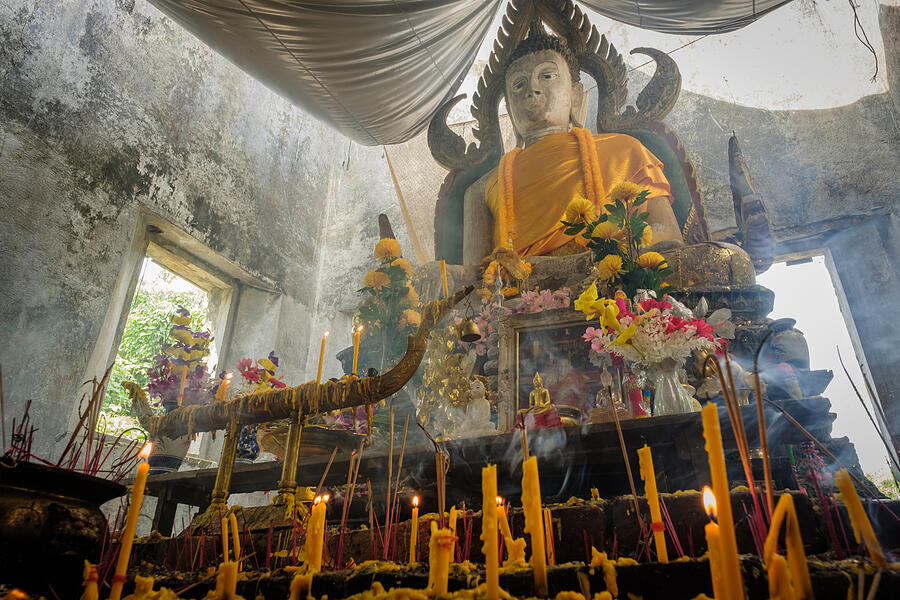 Public ancient Thai Buddha statue left in the forest Photograph by Iphotothailand