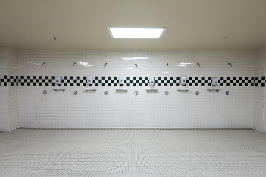 Public shower room Photograph by PhotoAlto/Sandro Di Carlo Darsa