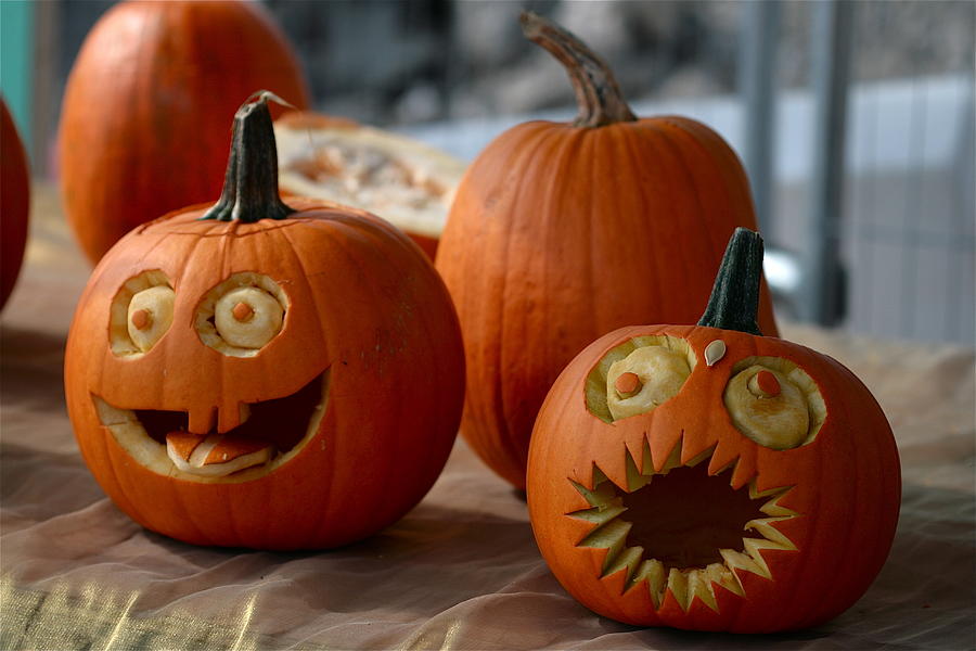 Pumpkins decorated with faces with eyes and mouths Photograph by Photography by paulgmccabe