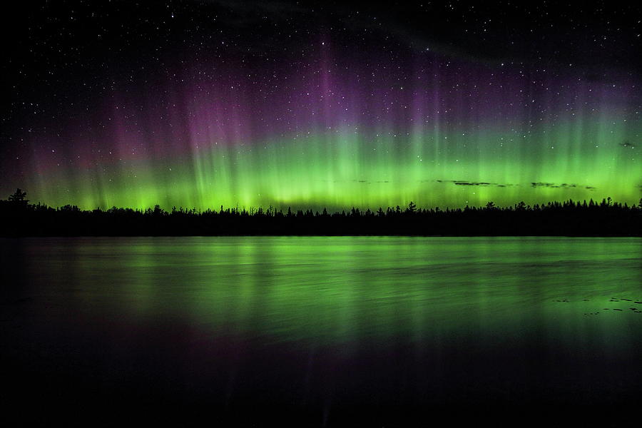 Purple And Green Northern Lights and Reflection Photograph by Dale Kauzlaric