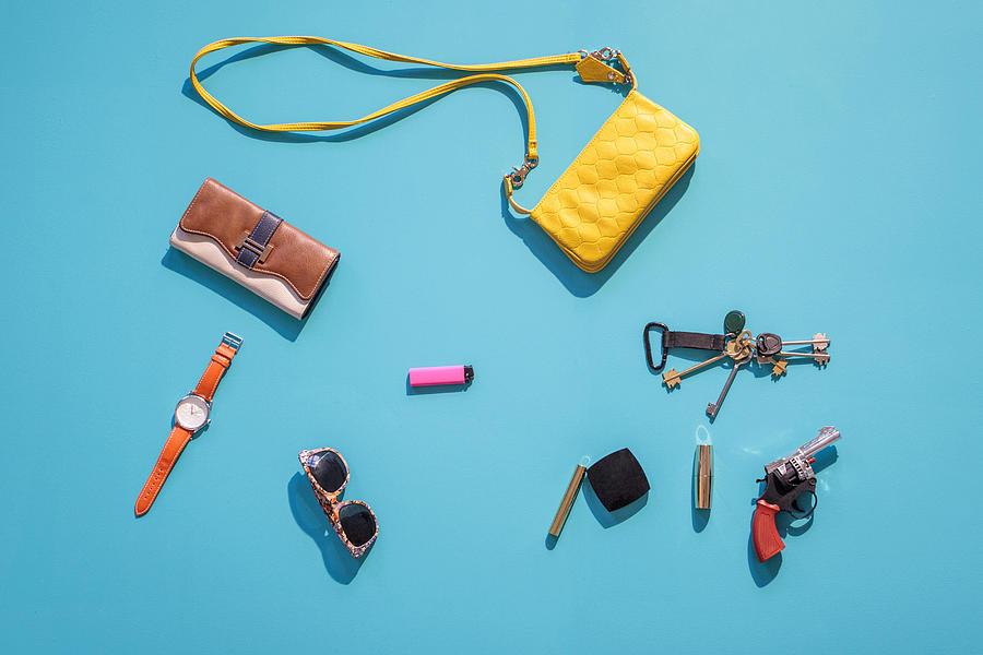 Purse, wallet, gun and accessories on blue background Photograph by Aliyev Alexei Sergeevich