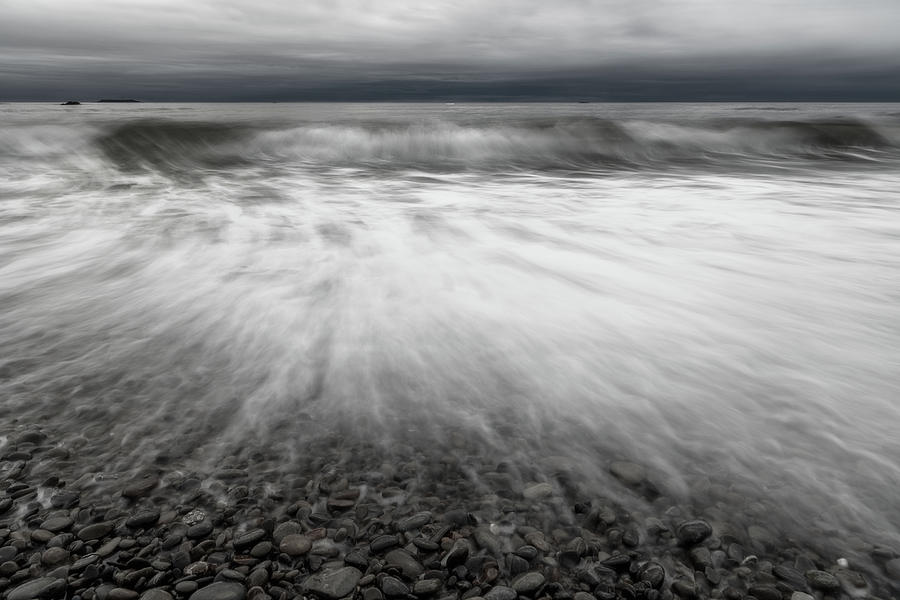 Push and pull of the ocean - monochrome Photograph by Murray Rudd