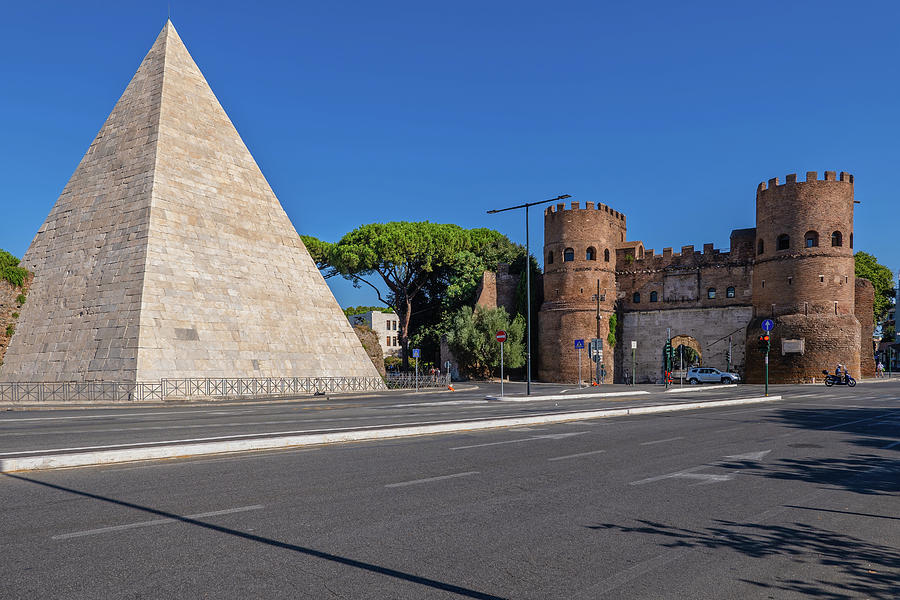 Pyramid of Cestius and San Paolo Gate in Rome Photograph by Artur Bogacki