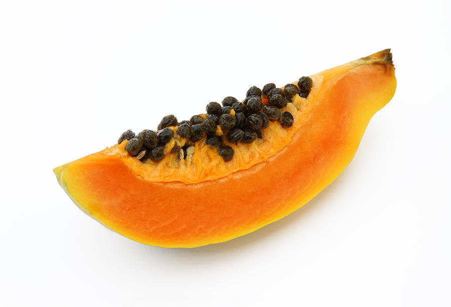 Quarater of a fresh, ripe papaya or paw paw. Photograph by Rosemary Calvert Quarater of a fresh, ripe papaya or paw paw. Photograph by Rosemary Calvert