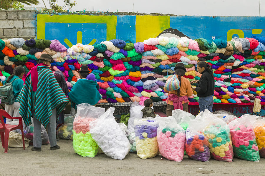 Quechua indians shop at fabric market, Ecuador Photograph by Patrick J Endres - AlaskaPhotoGraphics