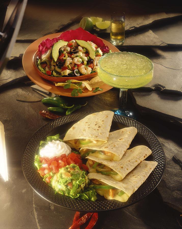 Quesadillas and shrimp with avocado salad Photograph by Jupiterimages