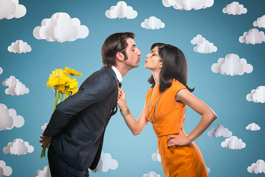 Quirky Stylish Couple Kissing Photograph by Spiderstock