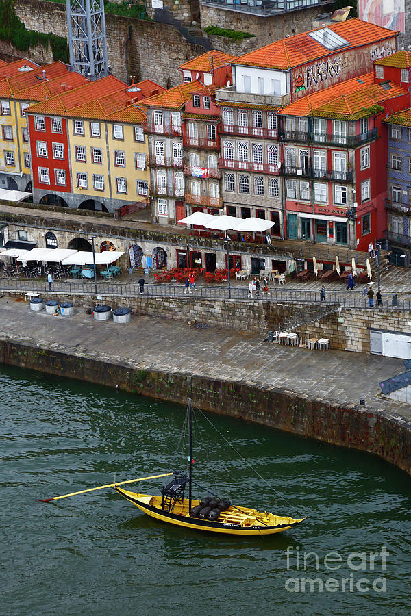 Boat Photograph - Rabelo boat moored on the historic Ribeira waterfront Oporto Portugal by James Brunker