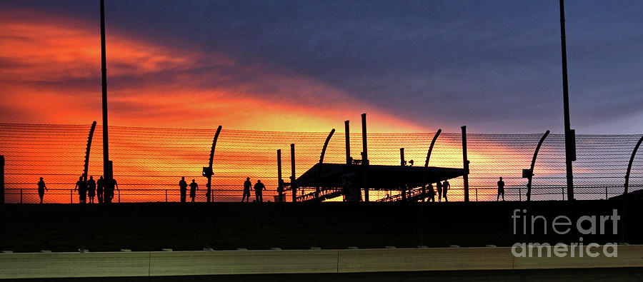 Race Fans silhouetted against Sunset Photograph by Pete Klinger