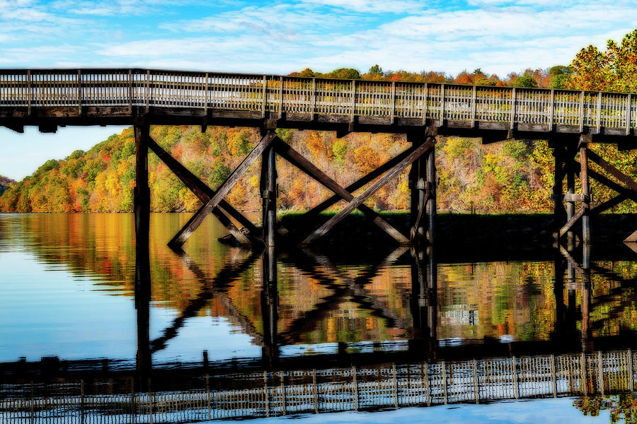 Rail trail bridge flections and fall colors Photograph by Dan Friend