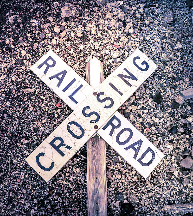 Railroad Crossing Sign On Stones Photograph by Dan Sproul