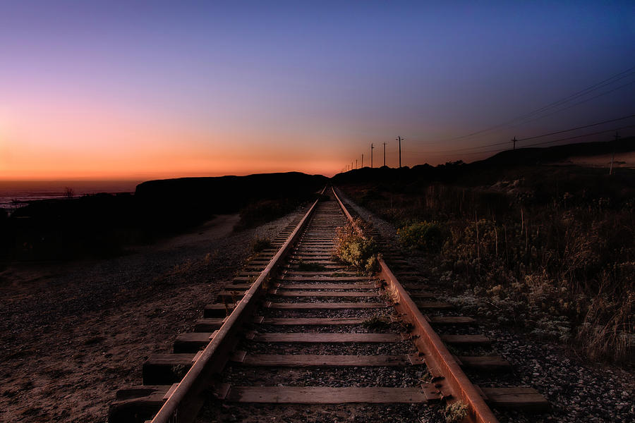 Railroad Tracks Leading To Sunset Photograph by Gary Geddes