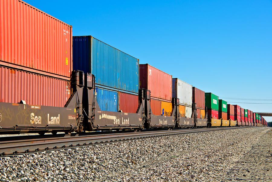 Railroad train freight container carriers, Palm Springs, California Photograph by JayLazarin
