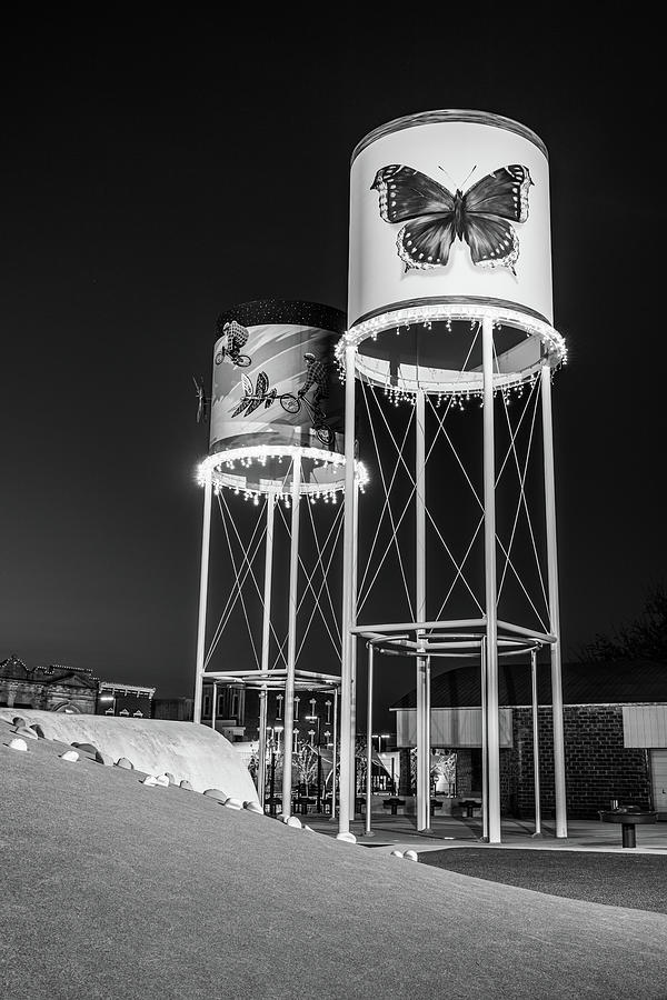Railyard Park Water Stop Towers Of Downtown Rogers Arkansas - Black And White Photograph by Gregory Ballos