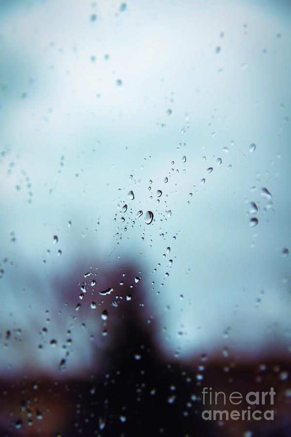 Rain drops on a window surface with blurry shadows Photograph by Mendelex Photography