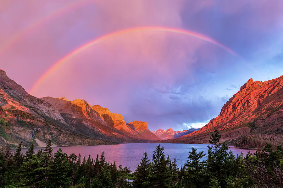 Rainbow above St. Mary Lake Photograph by Jack Bell