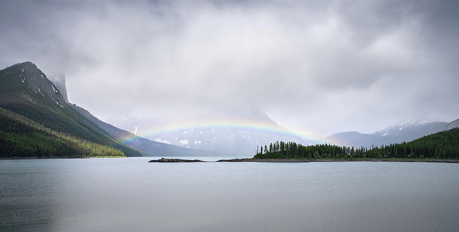 Rainbow arching above Kananaskis Lake in Canadian Rockies Photograph by Peter Kolejak