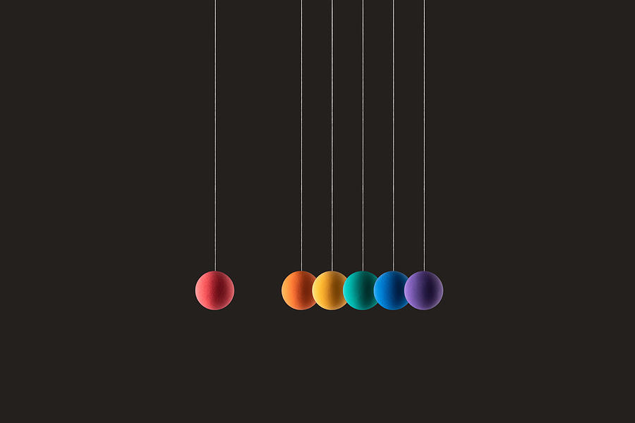 Rainbow Colored Spheres Hanging on Strings in a Row Photograph by MirageC