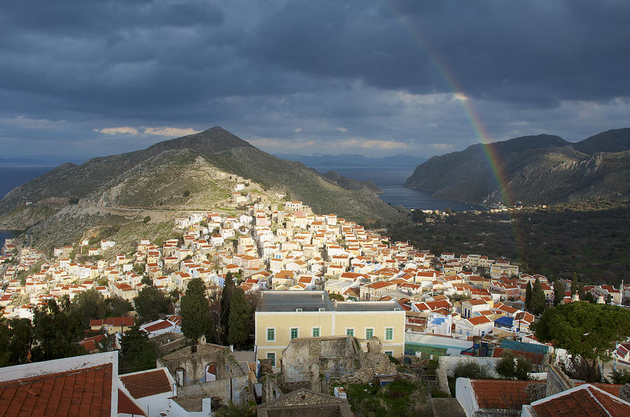 Rainbow in a cloudy sky above the houses of Horio. Photograph by Craig Pershouse