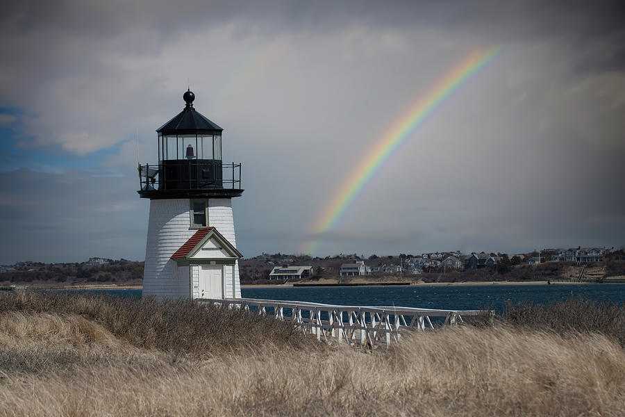 Rainbow over Brant Point lighthouse Photograph by Jeff Folger