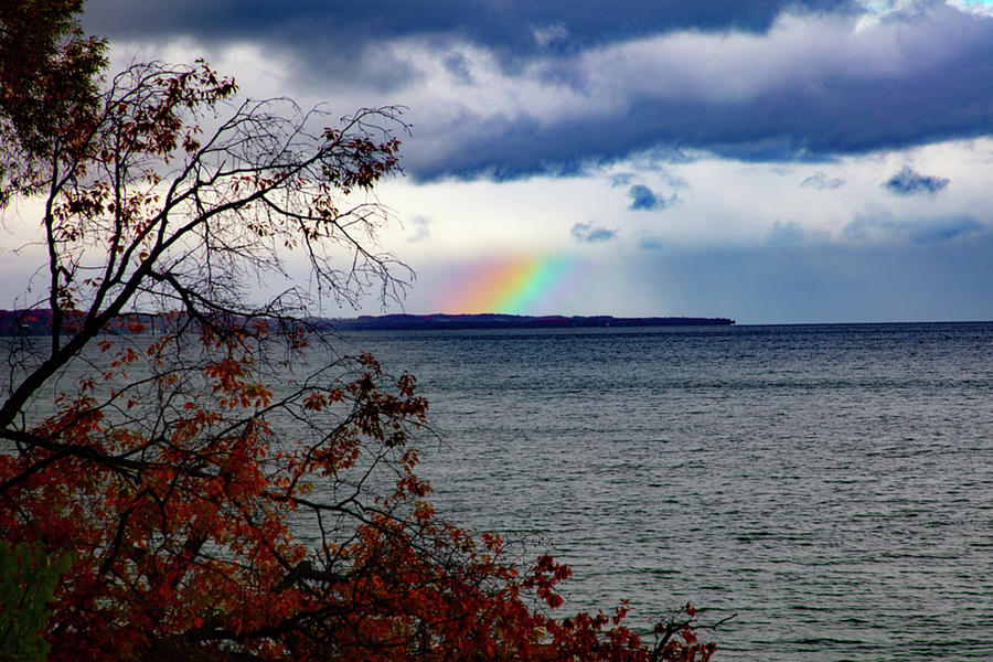 Rainbow peaking through over Grand Traverse Bay in Michigan Photograph by Eldon McGraw