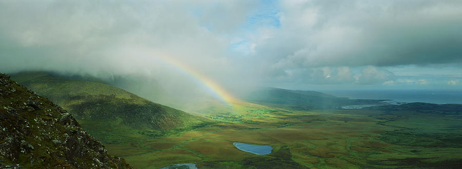 Rainbow stretching over rural landscape Photograph by Ron Bambridge