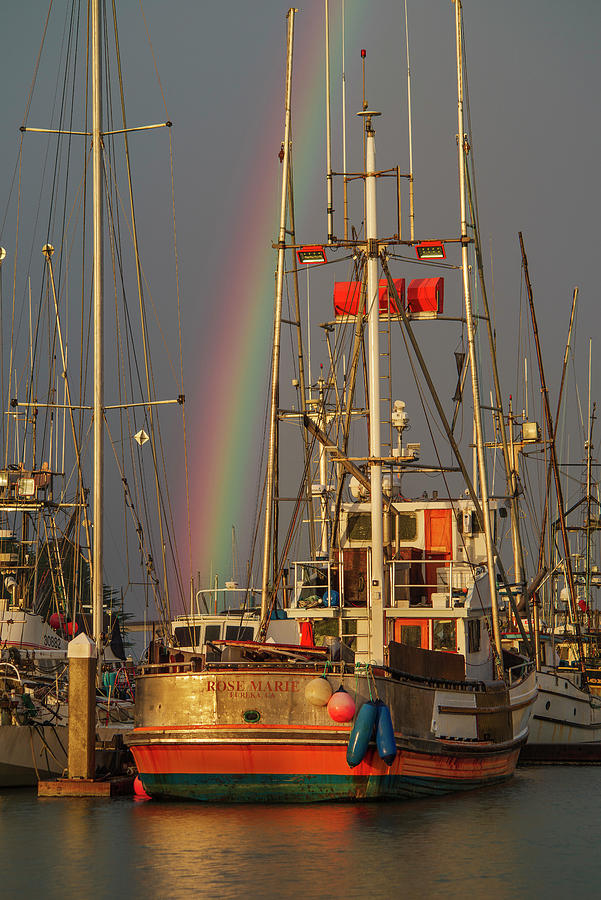Sunset Photograph - Rainbow Through the Boats by Greg Nyquist