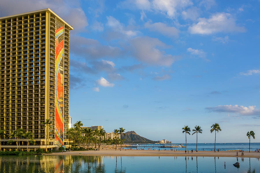 Rainbow tower frames the shore in Waikiki Hawaii Photograph by Steven Heap
