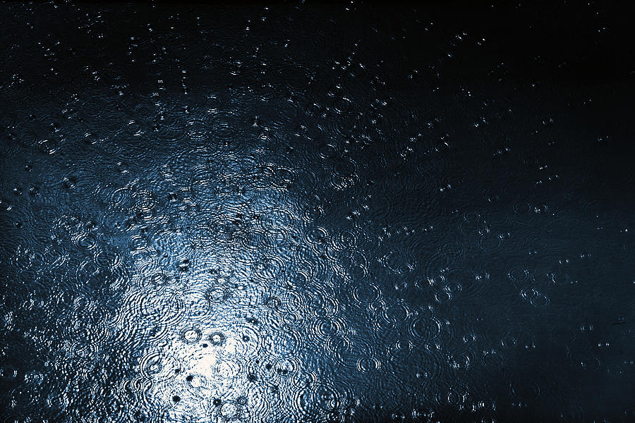 Raindrops falling in water Photograph by Subman