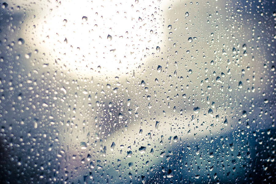 Raindrops on car window Photograph by ...