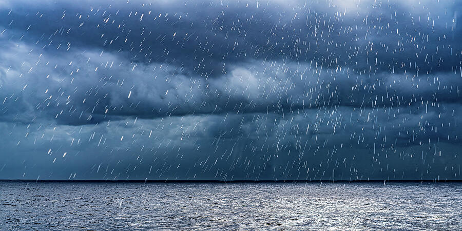 Raining Somewhere in the Caribbean Photograph by Tommy Farnsworth