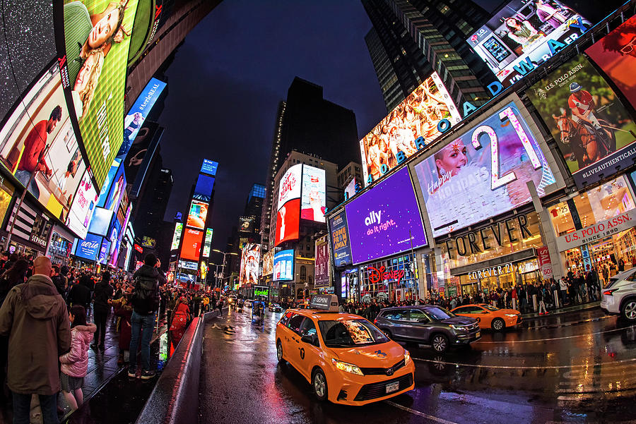 Rainy evening in Times Square in New York City Photograph by Toby McGuire