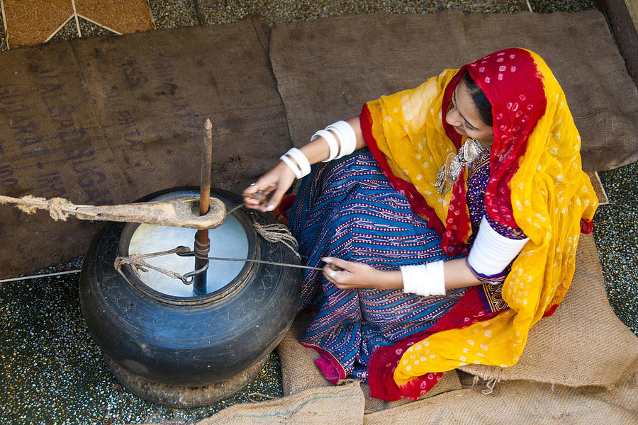 Rajasthani village woman churning butter milk, rajasthan, India Photograph by Dinodia Photo