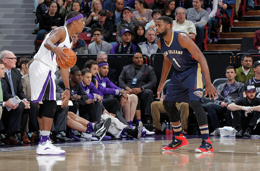 Rajon Rondo and Tyreke Evans Photograph by Rocky Widner