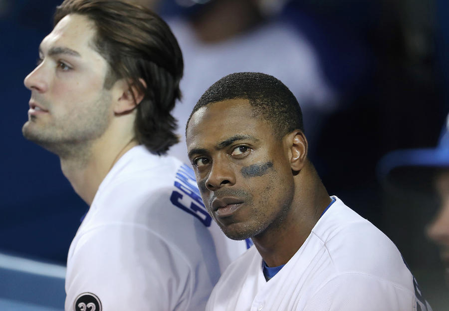 Randal Grichuk and Curtis Granderson Photograph by Tom Szczerbowski
