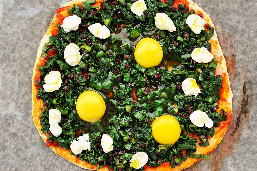 Raw round green pizza with chard, eggs and mozarella Photograph by AlexeyBorodin