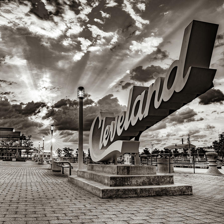 Cleveland Ohio Photograph - Rays of Light Over The Cleveland Script Sign on North Coast Harbor - Sepia by Gregory Ballos