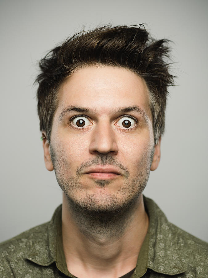 Real caucasian man with surprised expression looking at camera Photograph by SensorSpot