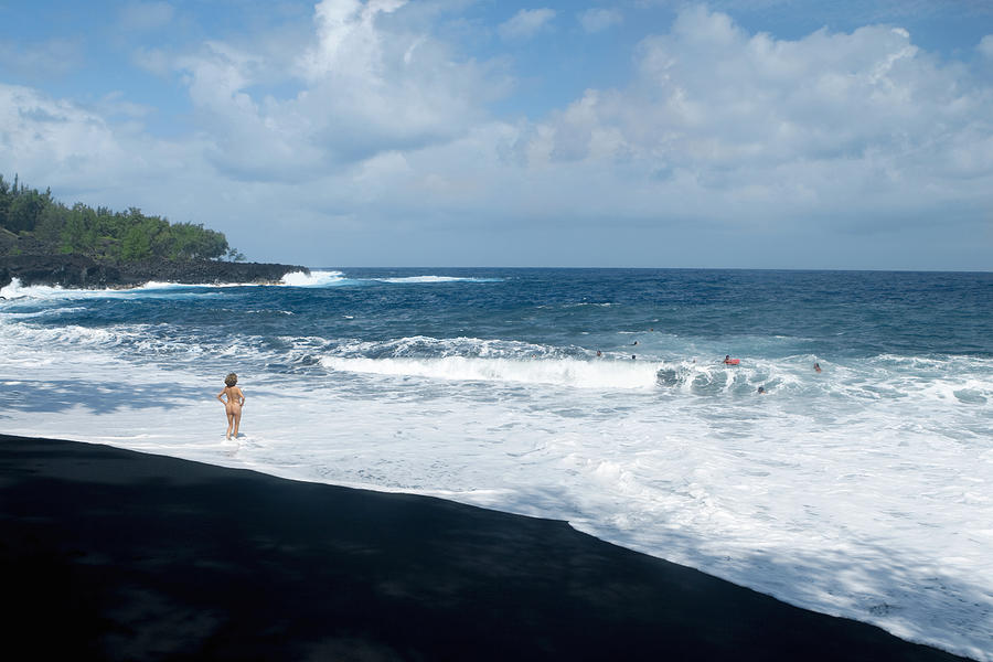 Rear view of a naked woman standing on the beach, Kehena Beach, Big Island, Hawaii Islands, USA Photograph by Glowimages