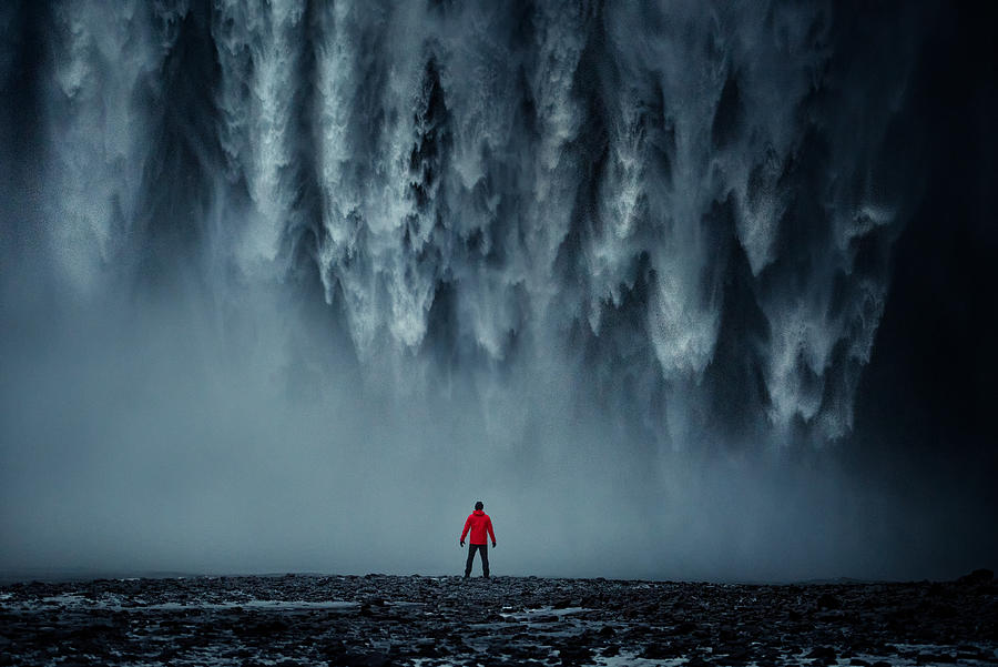 Rear View Of Man Standing Against Skogafoss Photograph by Sahacha Nilkumhang
